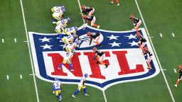The Rams and Bengals line up over the NFL logo in the first half during Super Bowl LVI between the Cincinnati Bengals and the Los Angeles Rams on February 13, 2022, at SoFi Stadium in Inglewood, CA.