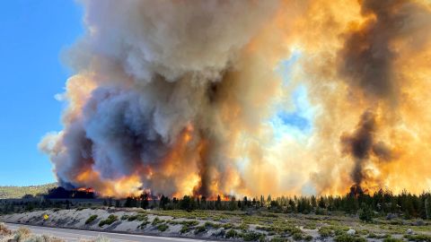 Smoke rises as the Mill Fire burns on the outskirts of Weed, California, Friday.