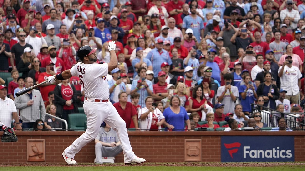 Albert Pujols watches his two-run homer at the top of the eighth inning.