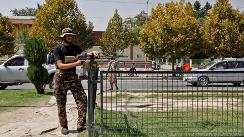 A Taliban fighter stands guard after a blast in front of the Russian embassy in Kabul, Afghanistan, on Monday. 