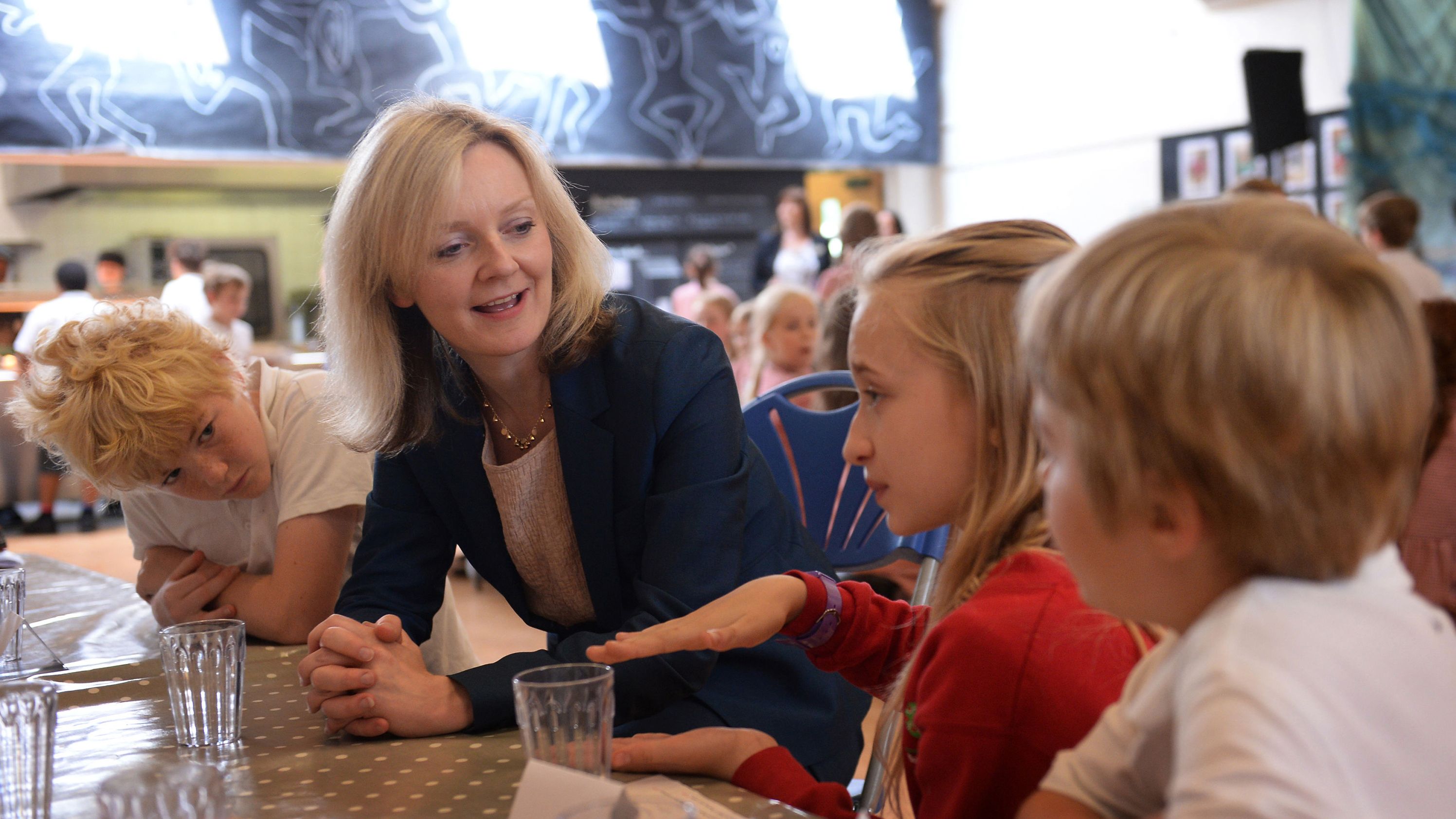 Truss meets students at a school in west London in July 2014. She was launching a new government plan to get more locally sourced and grown food into schools and hospitals.