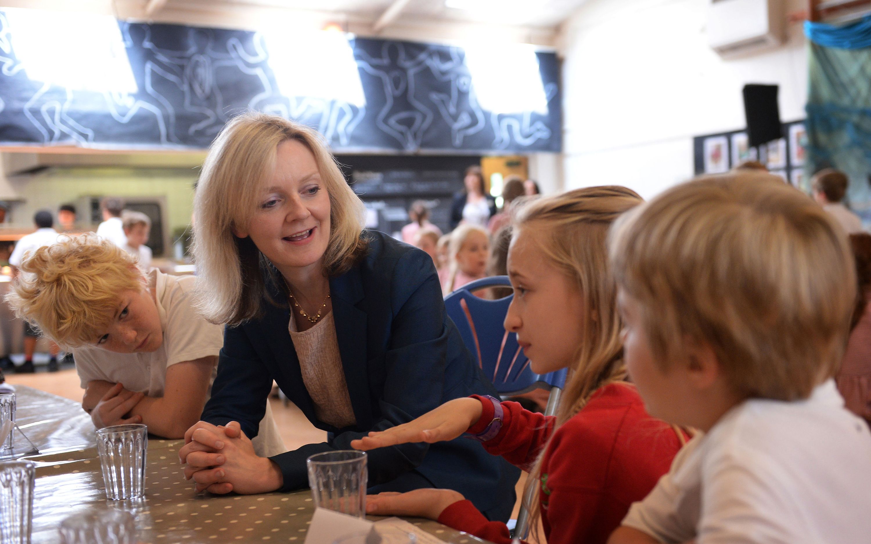 Truss meets students at a school in west London in July 2014.