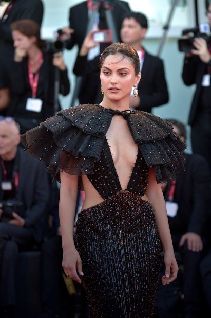 Actor Camila Mendes also opted for an Armani Privé look, complete with geometric cut-outs and a large, embellished ruffle shoulder cape. 