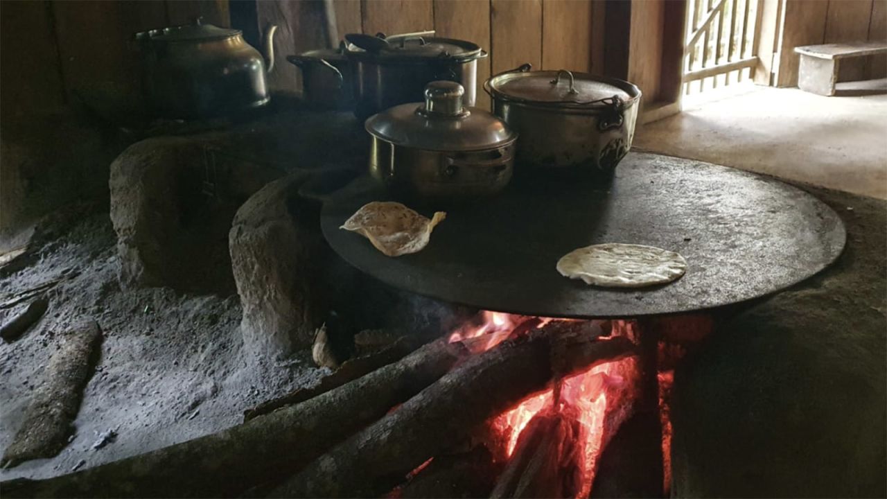 Women in the community make food from what is grown on the land, including corn tortillas, which are eaten with almost every meal.