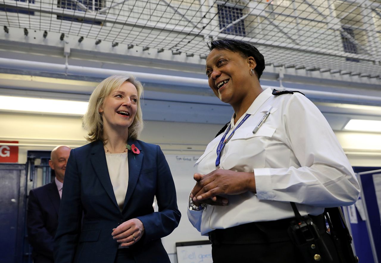 Truss speaks with Custodial Manager Wendy-Fisher McFarlane as she is escorted around the HM Prison Brixton in November 2016.
