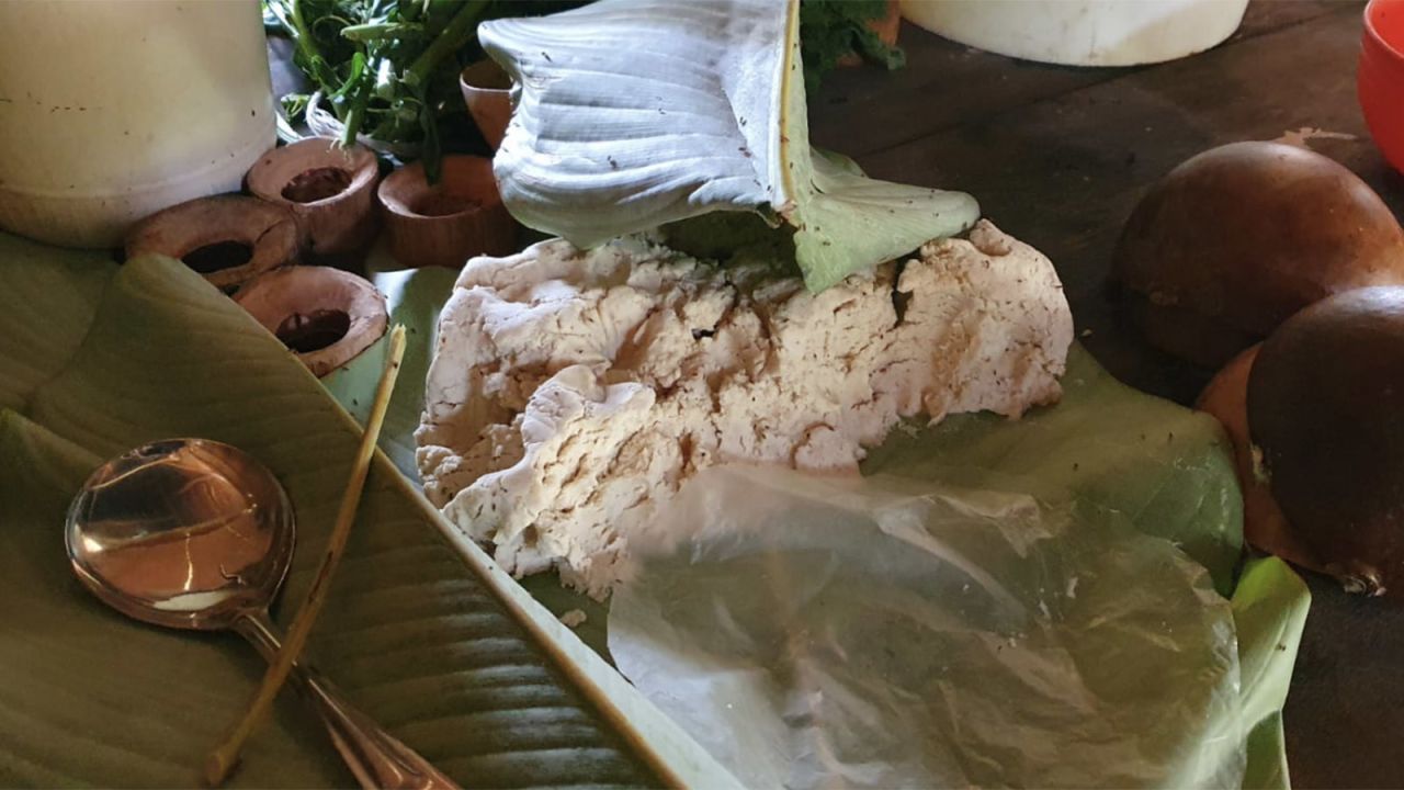 Maize dough is wrapped in a large leaf to keep it fresh.