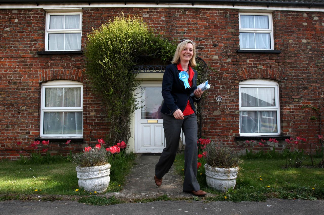 While running for Parliament, Truss canvasses in the village of West Walton in 2010. She was elected later that year. Truss was born in 1975 into a family that she herself has described as 