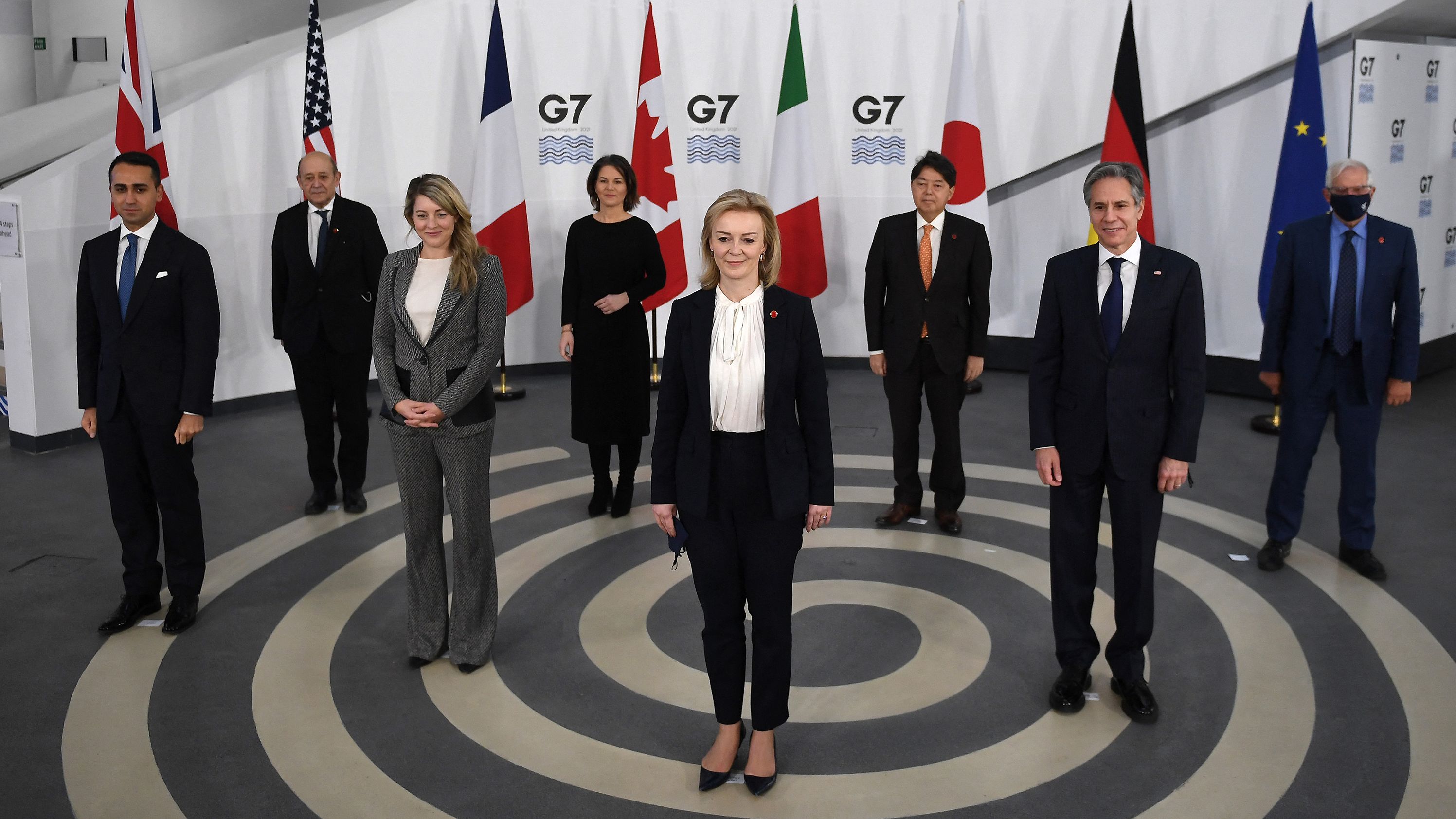 Truss, center, poses for a group photo with other G7 foreign ministers ahead of a meeting in Liverpool, England, in December 2021.