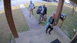 Surveillance video shows Cathy Latham with Scott Hall entering the Coffee County Elections office on Jan. 7, 2021, along with a third unknown individual.