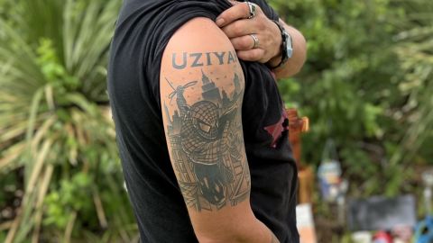 Brett Cross shows off his tattoo in honor of his murdered nephew, Uziyah Garcia, whom he raised as his own son.