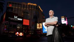 Jeff German, host of "Mobbed Up," poses with Planet Hollywood, formerly the Aladdin, in the background on the Strip in Las Vegas, Wednesday, June 2, 2021. Authorities say German, a Las Vegas investigative reporter has been stabbed to death outside his home and police are searching for a suspect. The Las Vegas Review-Journal says officers found journalist German dead with stab wounds around 10:30 a.m. Saturday, Sept. 3, 2022, after authorities received a 911 call. (K.M. Cannon/Las Vegas Review-Journal via AP)