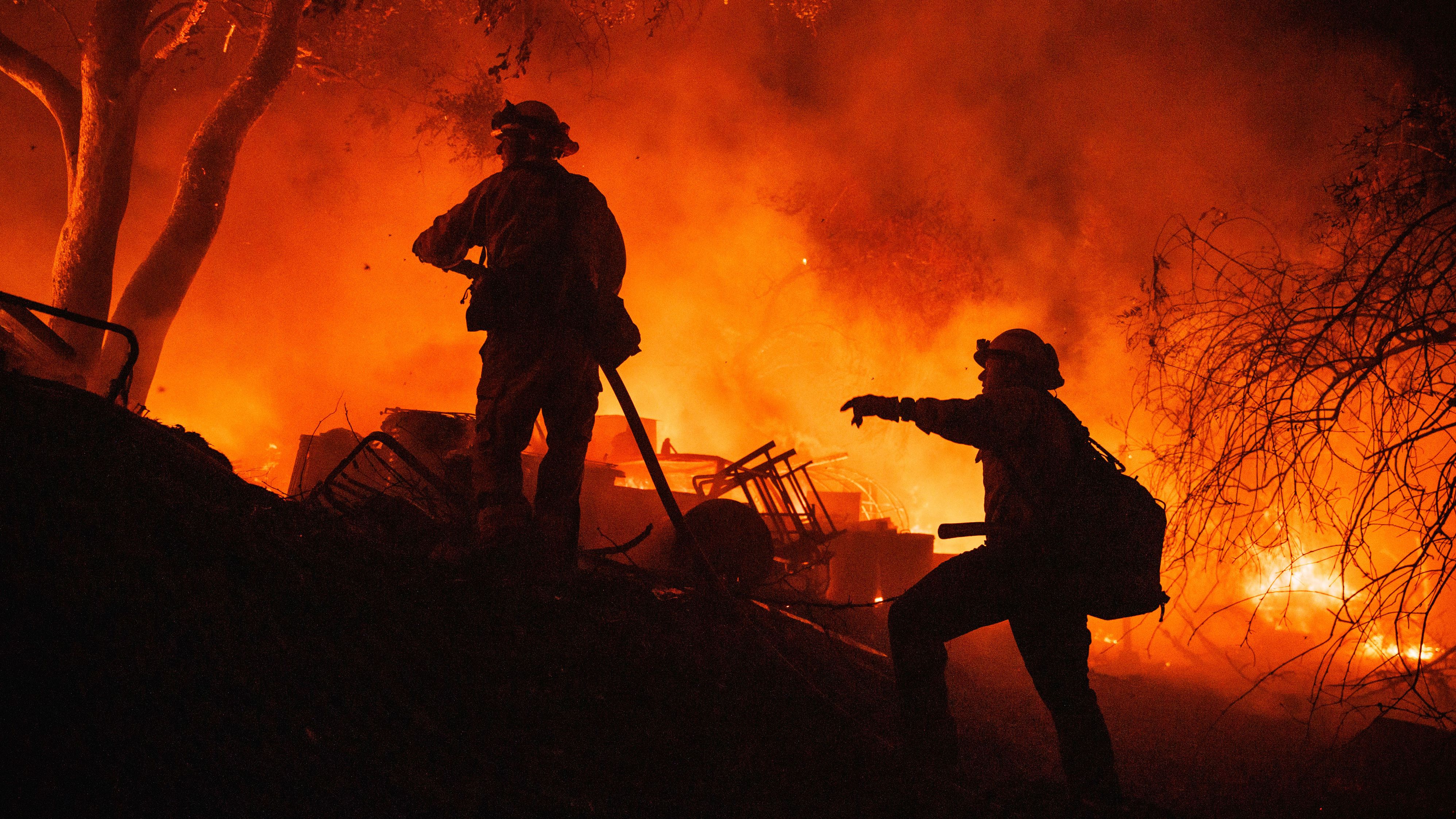 Firefighters battling the fast-moving Fairview Fire near Hemet, California, on Monday.