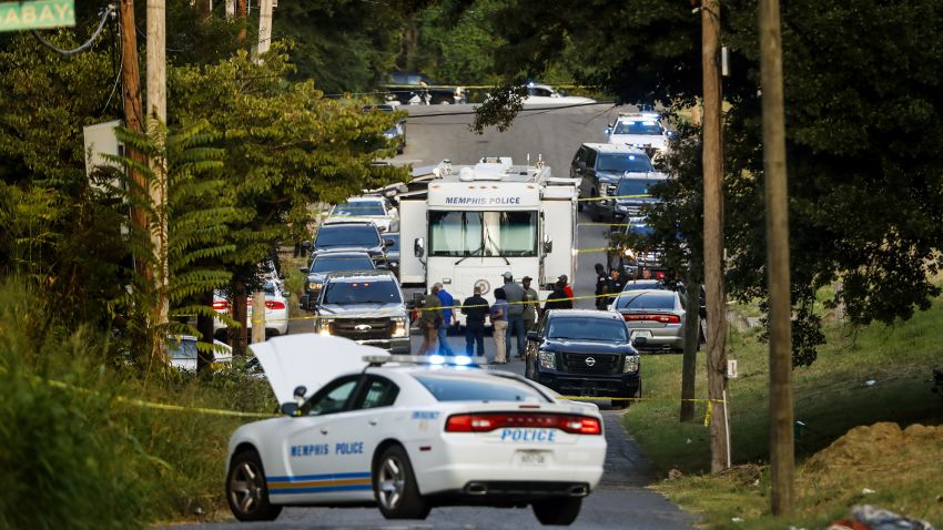 Memphis police officers search an area where a body had been found in South Memphis, Tenn., near Victor Street and East Person Ave., Monday, Sept. 5, 2022. Police have not confirmed the identity of the body and the cause of death was unconfirmed. (Mark Weber/Daily Memphian via AP)