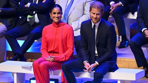 Meghan, Duchess of Sussex and Prince Harry react as they attend the annual One Young World Summit  in Manchester, north-west England on September 5, 2022.