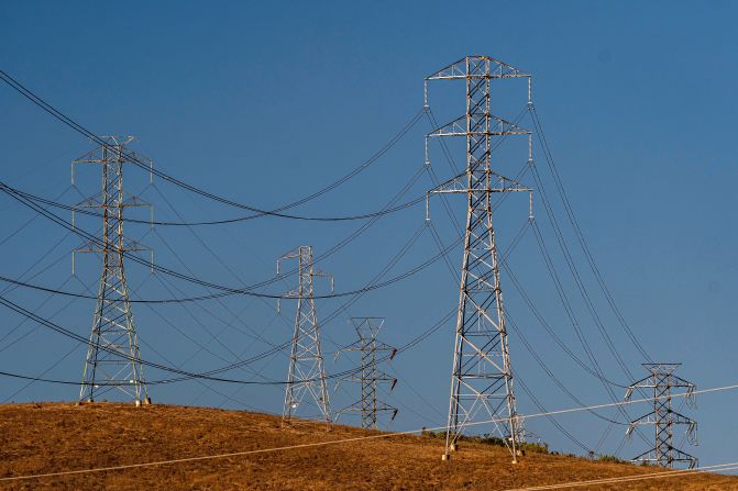 Electrical transmission towers are seen in Vallejo, California, on Sunday, September 4. Blisteringly hot temperatures and a rash of wildfires are posing a twin threat to California's power grid.
