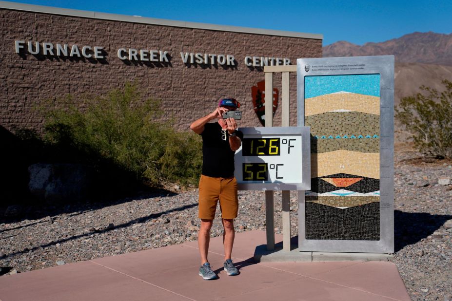 A man takes a selfie at a thermometer in California's Death Valley National Park on Thursday, September 1.