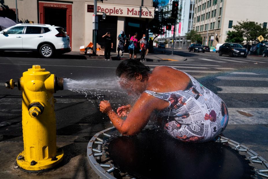 Stephanie Williams cools off at a fire hydrant in Los Angeles' Skid Row neighborhood on August 31.