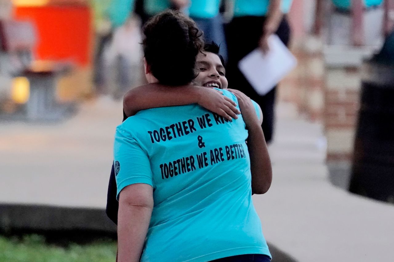 A teacher in Uvalde, Texas, hugs a student arriving at Uvalde Elementary for the first day of school on Tuesday, September 6.