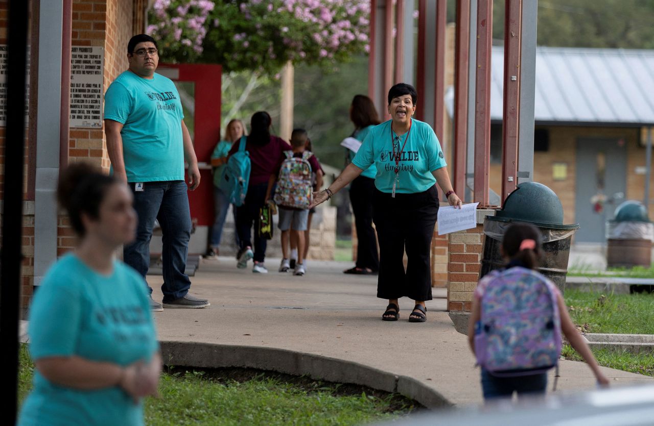 Workers at Uvalde Elementary greet students on Tuesday.