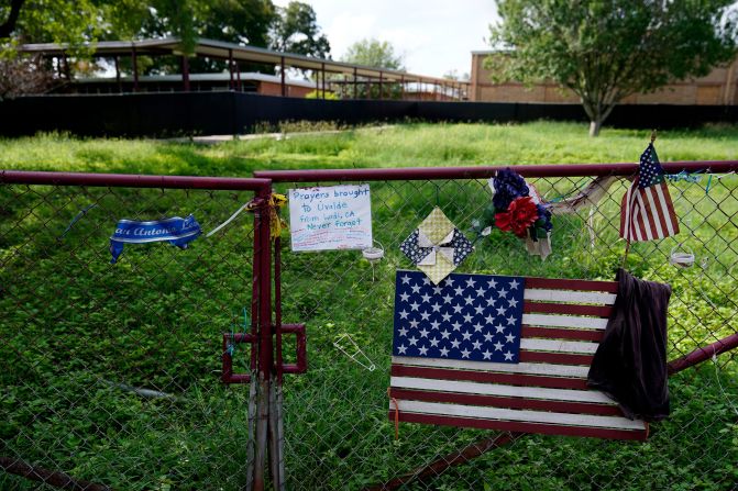 Memorial remnants are still seen at Robb Elementary, the site of May's mass shooting, as it sat idle on Tuesday. That school is going to be demolished.