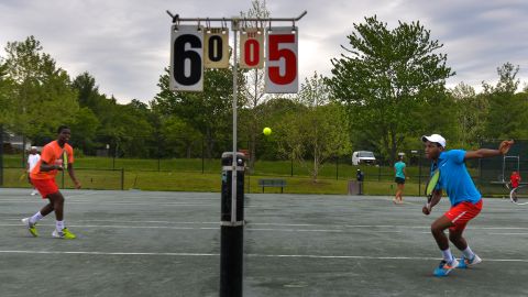 Tiafoe and his twin brother Franklin play in a fundraiser tournament in 2014.