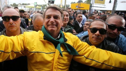 Brazil's President Jair Bolsonaro greets supporters while visiting an agricultural fair on September 2.