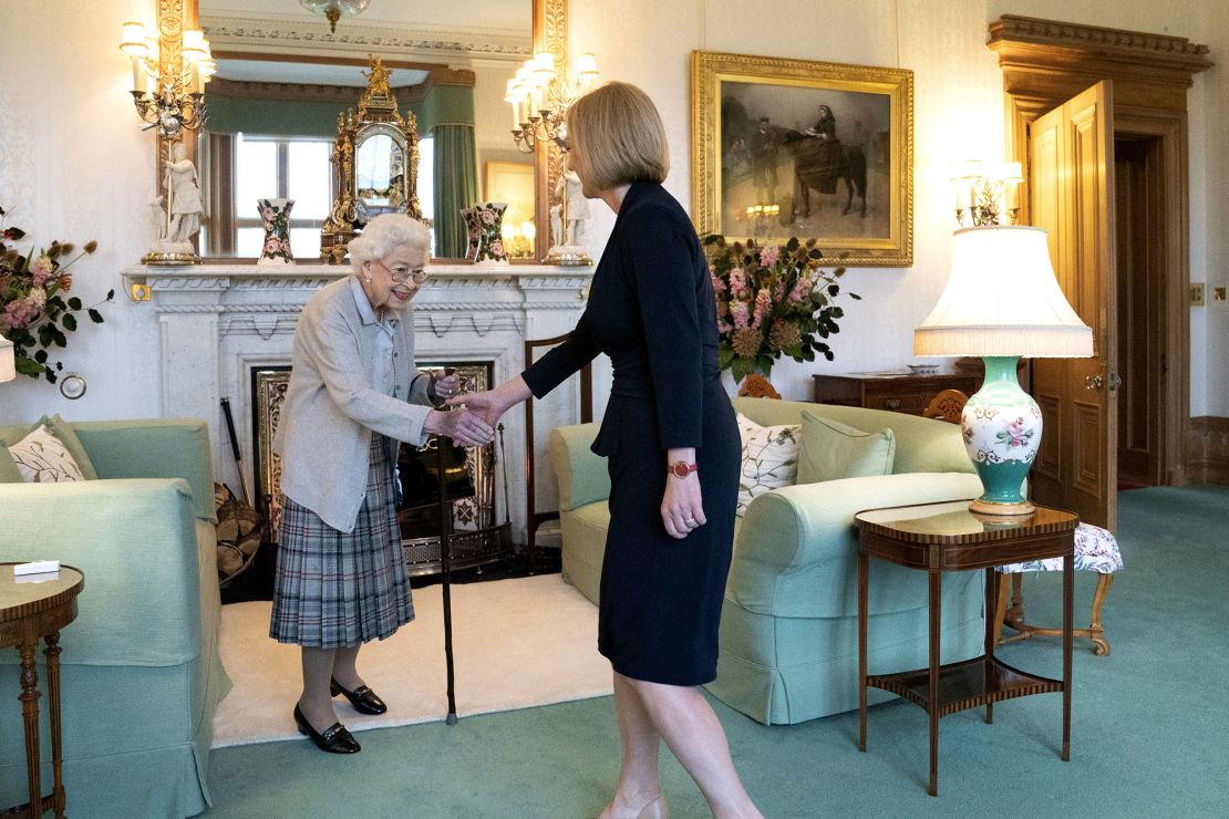 Britain's Queen Elizabeth II, left, welcomes Liz Truss during an audience at Balmoral, Scotland, where she invited the newly elected leader of the Conservative party to become Prime Minister and form a new government, Tuesday, Sept. 6, 2022. 