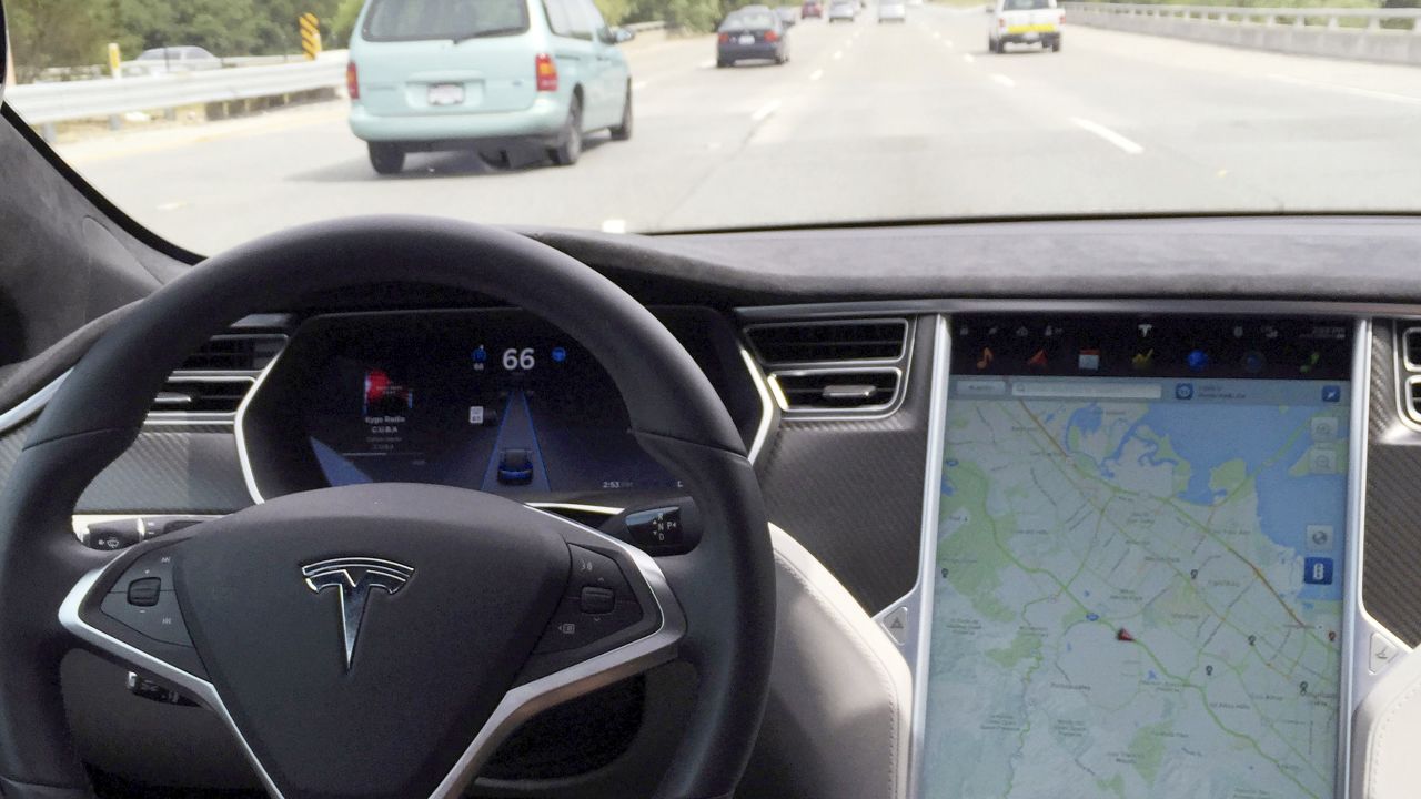 A Tesla Model S with Autopilot is shown.