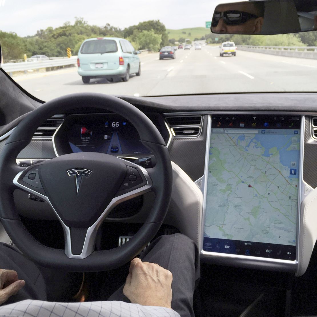 A Tesla Model S with Autopilot is shown.