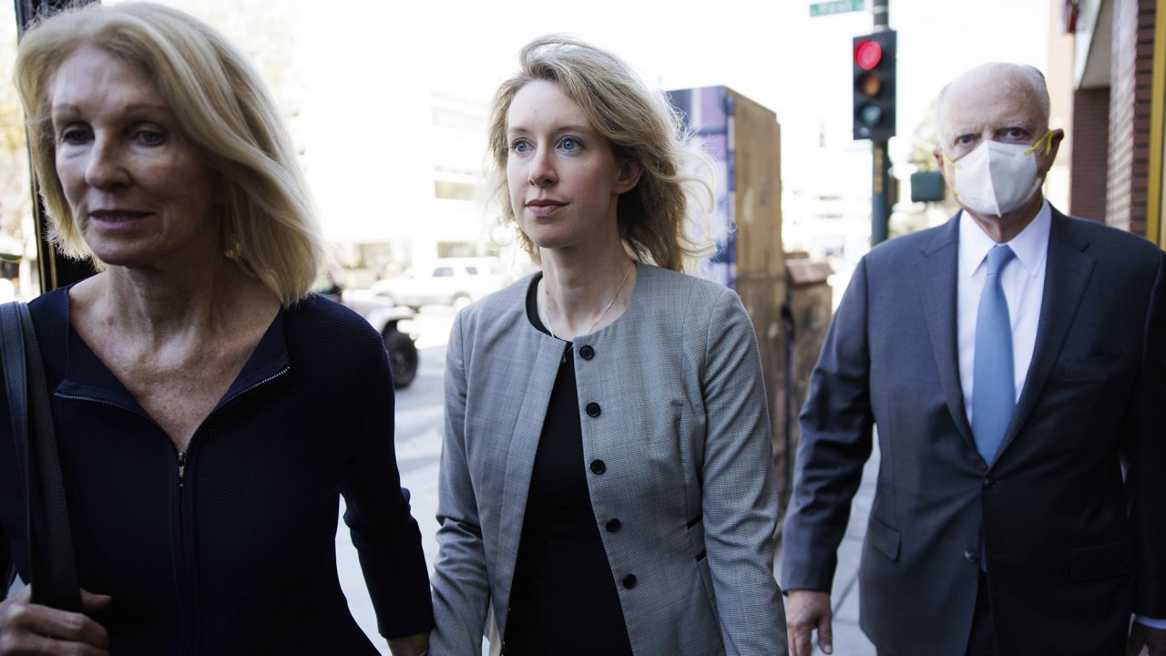 Theranos founder Elizabeth Holmes, center, and her parents, Noel Holmes, left, and Christian Holmes, leave the Robert F. Peckham Federal Building and U.S. Courthouse in San Jose, Calif., on Thursday, Sept. 1, 2022. A federal judge on Thursday tentatively declined to overturn the jury conviction of disgraced Theranos CEO Elizabeth Holmes on four felony counts of fraud and conspiracy. That leaves the former Silicon Valley star a step closer to serving prison time.