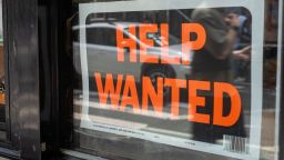 NEW YORK, NEW YORK - JULY 28: A "help wanted" sign is displayed in a window in Manhattan on July 28, 2022 in New York City.