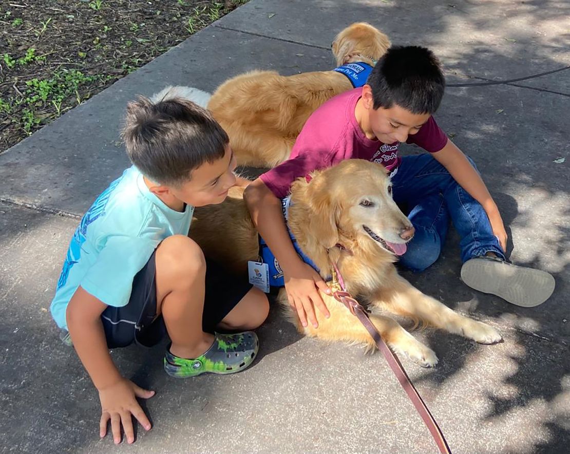 Comfort dog Cubby from Fort Collins, Colorado, reunited with a family she met during the deployment in Uvalde, Texas in May.