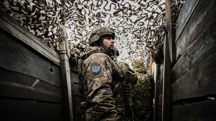 Ukrainian troops patrol at the frontline outside the town of Novoluhanske, eastern Ukraine, on February 19, 2022.