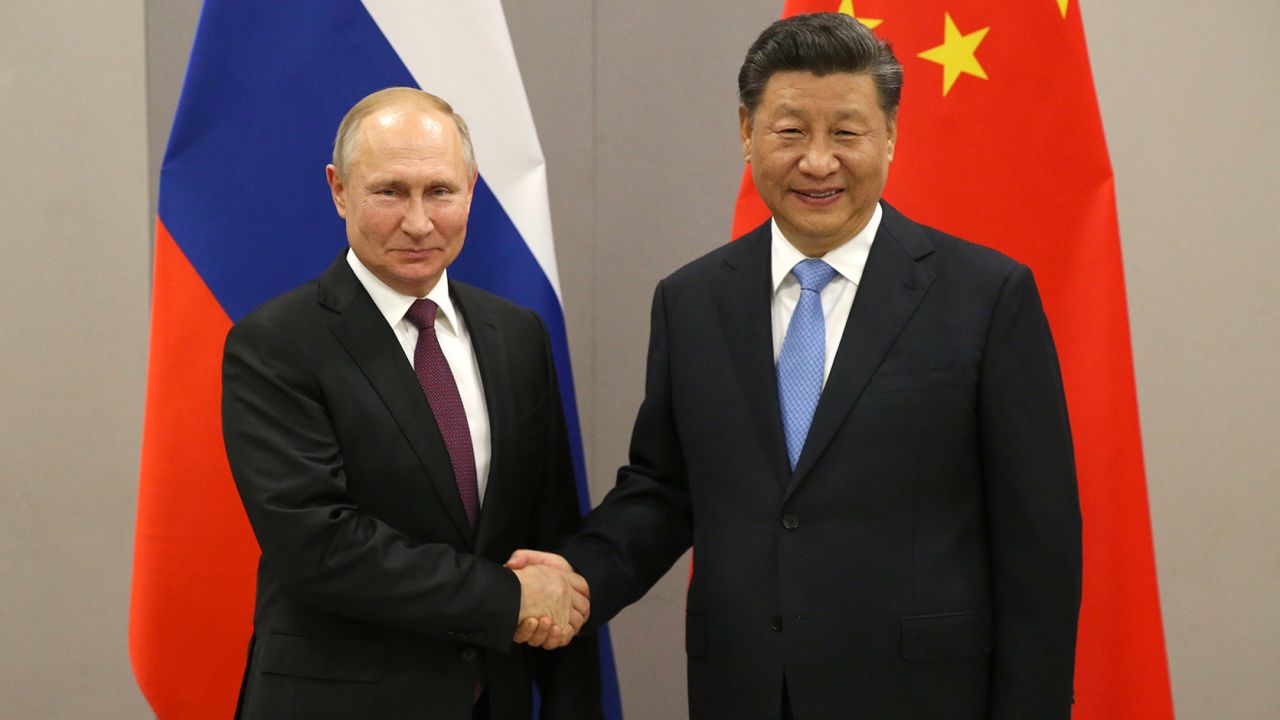 Russian President Vladimir Putin with Chinese leader Xi Jinping on November 13, 2019, in Brasilia, Brazil. 