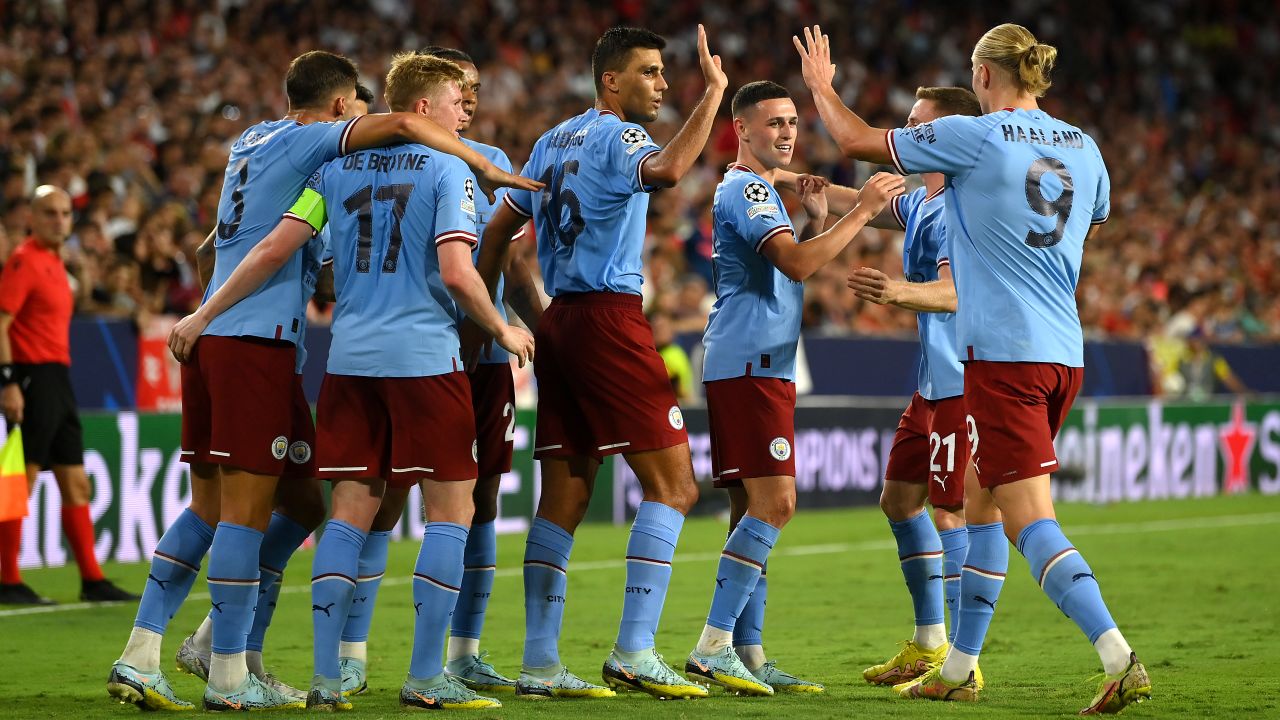 City players celebrate their second goal against Sevilla. 