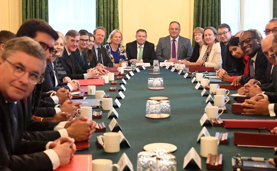 Prime Minister Liz Truss (left, center) holds the first meeting of her new Cabinet on Wednesday.