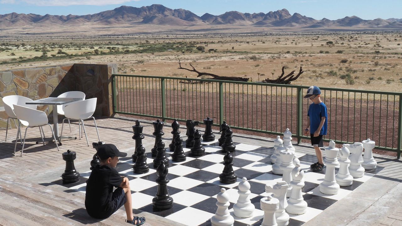 <strong>Fun and games: </strong>Brothers Leo and Colin playing chess at the Kronenhof Lodge in Namibia.