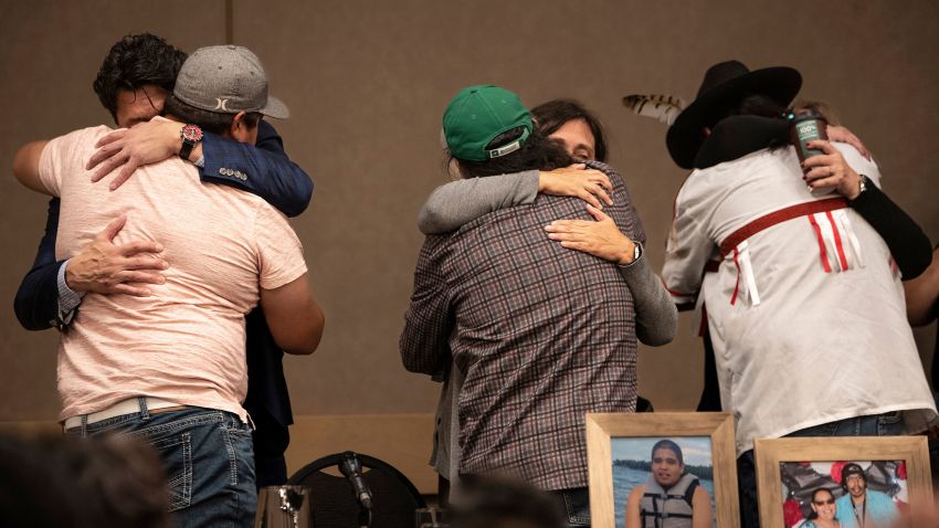 Family of the victims of a series of stabbings on the James Smith Cree Nation reserve in the Canadian province of Saskatchewan hug following a news conference in Saskatoon, Saskatchewan on Wednesday, Sept. 7, 2022.  Myles Sanderson, 32, and his brother Damien, 30, are accused of killing 10 people and wounding 18 in a string of attacks across an Indigenous reserve and in the nearby town of Weldon. Damien was found dead Monday, and police were investigating whether his own brother killed him.  (AP Photo/Robert Bumsted)