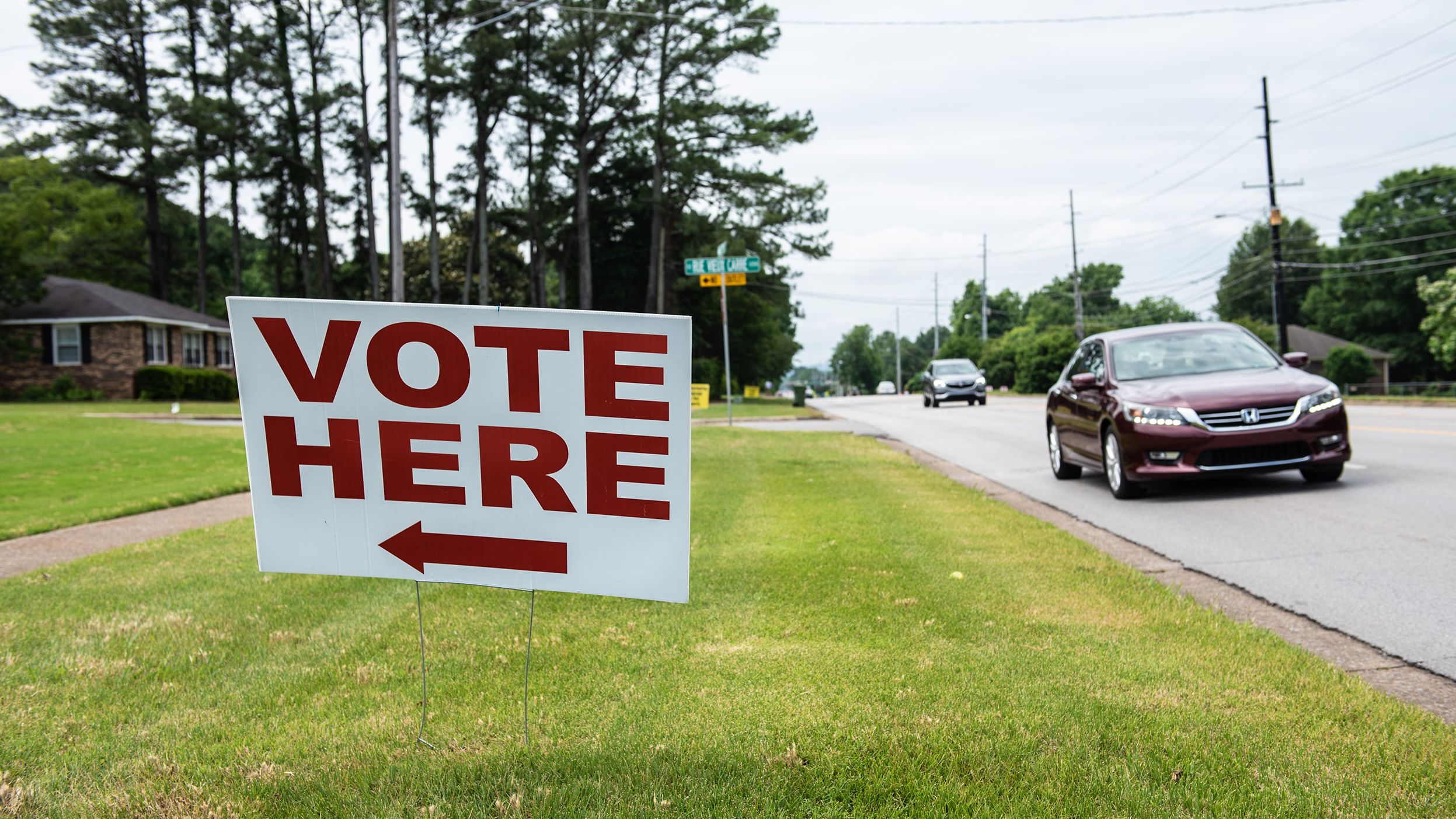 A "Vote Here" sign located outside a polling station in Huntsville, Alabama, US, on Tuesday, May 24, 2022. 