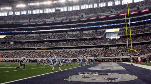 Then Dallas QB Tony Romo leads the Cowboys into the red zone against the Detroit Lions on October 2, 2011 in Arlington, Texas.