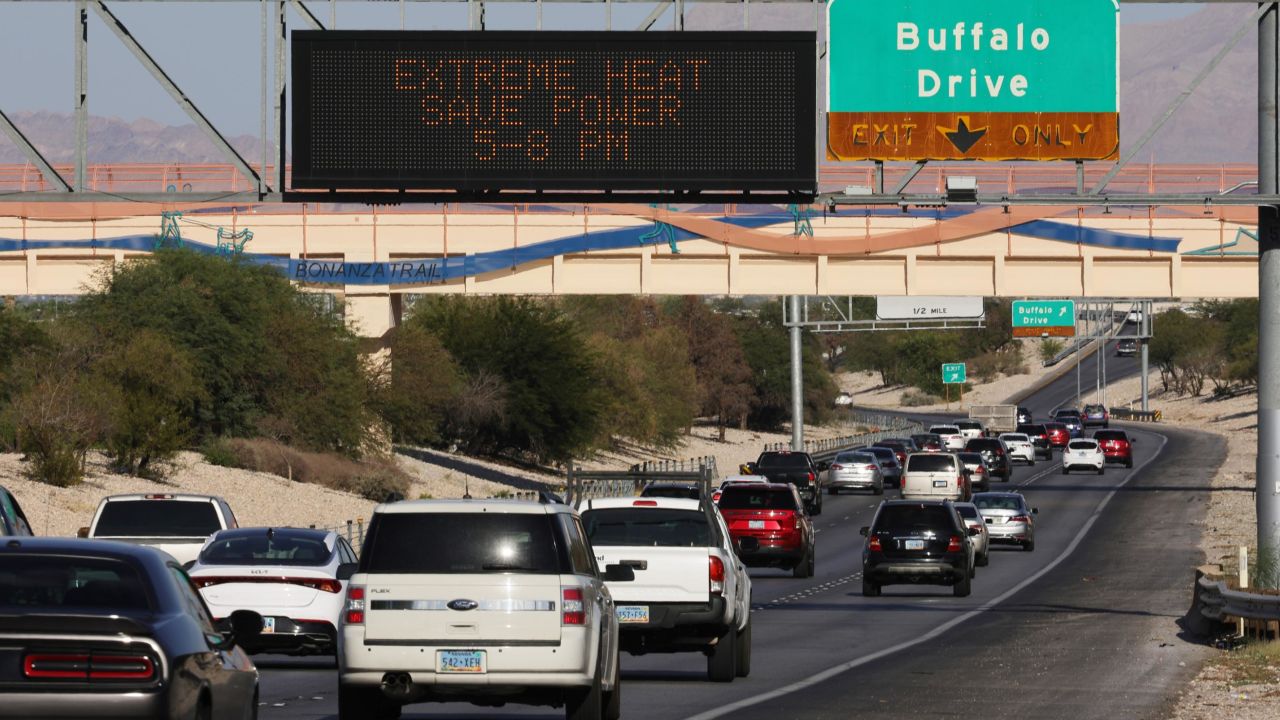 A road sign implores motorists to save power Wednesday due to extreme heat in Las Vegas.