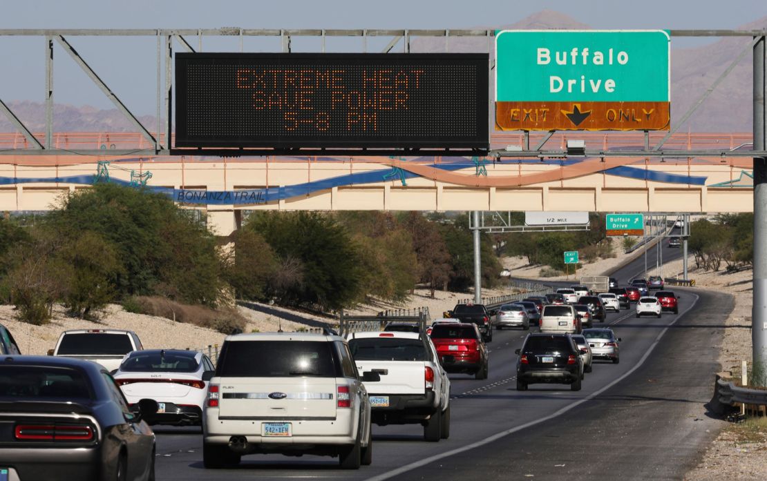 A road sign implores motorists to save power Wednesday due to extreme heat in Las Vegas.