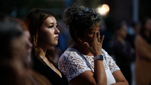 A pistillate   cries during a vigil for the stabbing onslaught  victims successful  Saskatchewan, Canada.