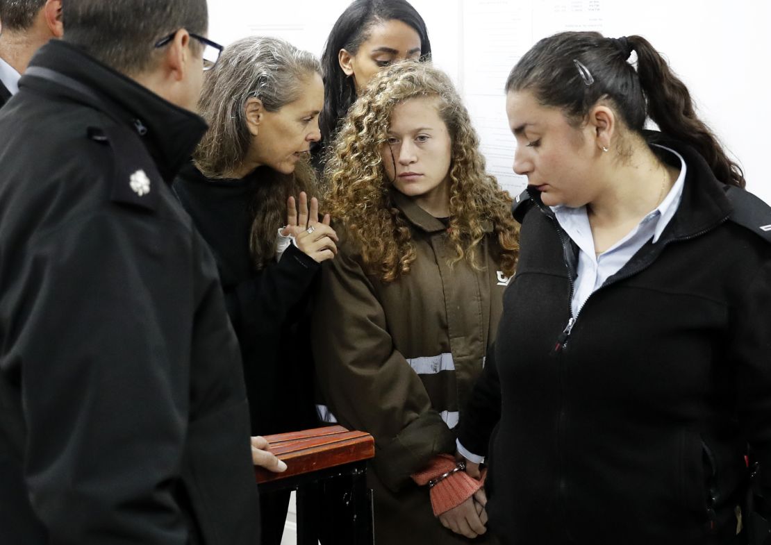 Ahed Tamimi speaks with her lawyer before a hearing in the military court at Ofer military prison on January 1, 2018.