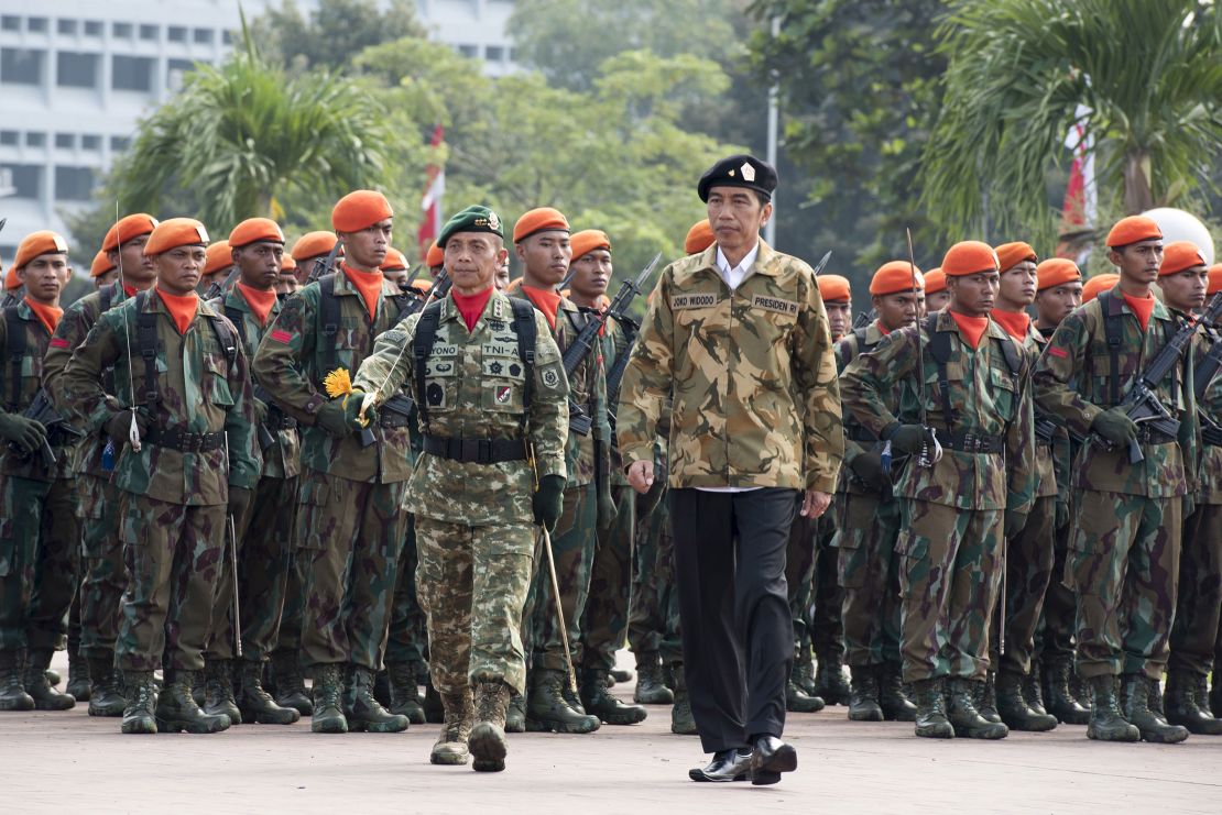 Indonesian President Joko Widodo reviews members of the military's special armed forces.