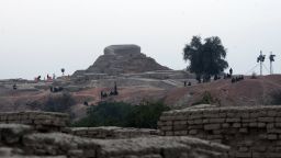 Pakistani policemen sit around the ancient ruins of Moenjodaro, the UNESCO World Heritage site around 425 kilometres north of the port city of Karachi on February 1, 2014.