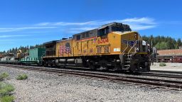 A Union Pacific locomotive pulling railcars is visible on tracks in Truckee, California, June 16, 2022.