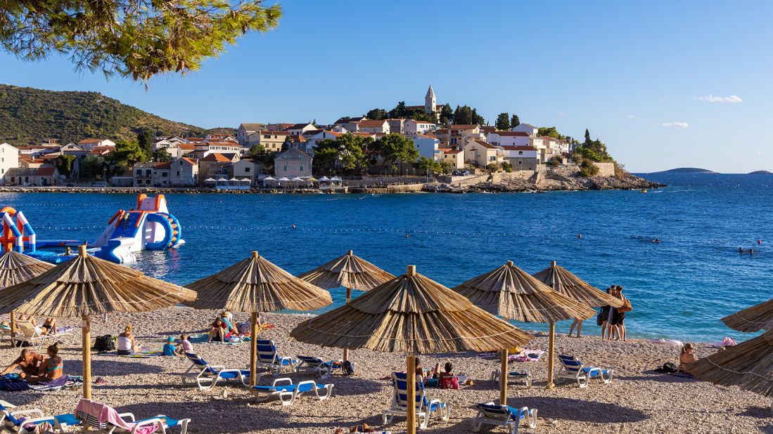 <strong>Primošten: </strong>This ancient island town is connected to the mainland, and sandy beaches, by a narrow causeway.  The town's old lanes harbor handicraft shops, clothing boutiques and traditional restaurants. Rising high above their red-tiled roofs, St. George's Church dominates a hilltop with awesome Adriatic views.