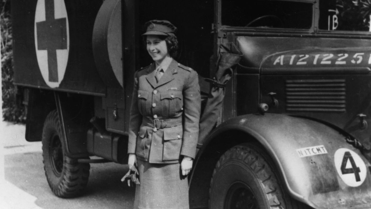 Princess Elizabeth is pictured in 1945 standing by an Auxiliary Territorial Service first aid truck wearing an officer's uniform. 