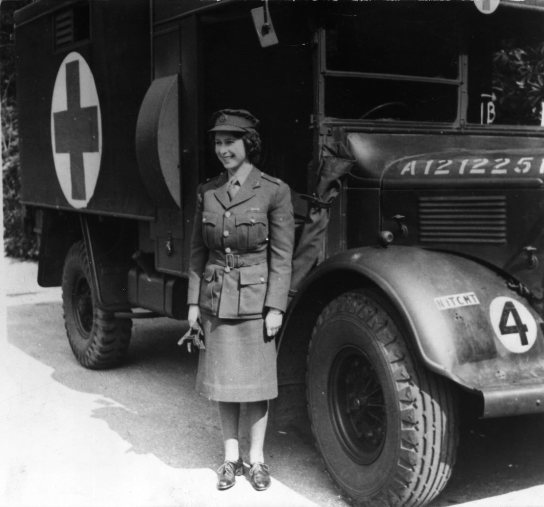 Princess Elizabeth is pictured in 1945 standing by an Auxiliary Territorial Service first aid truck wearing an officer's uniform.